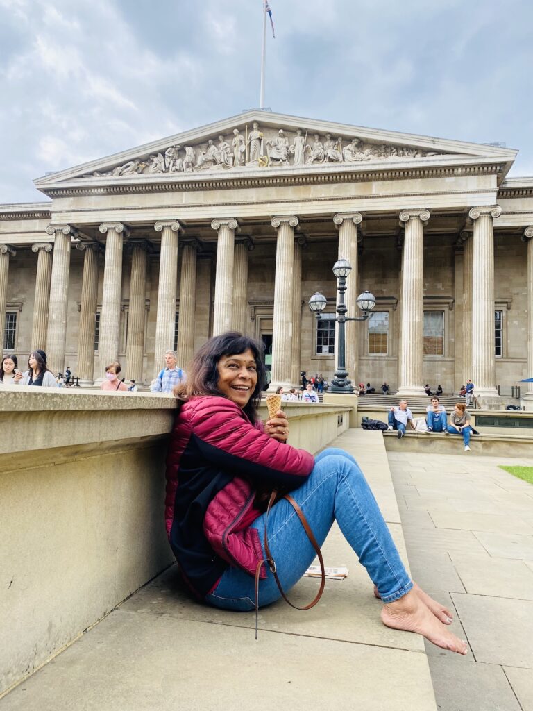 Lady sitting in a backdrop of British Museum, London